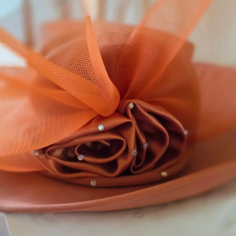 NIB Tania Bella burnt‎ orange hat, with satin rose and mesh, gems
